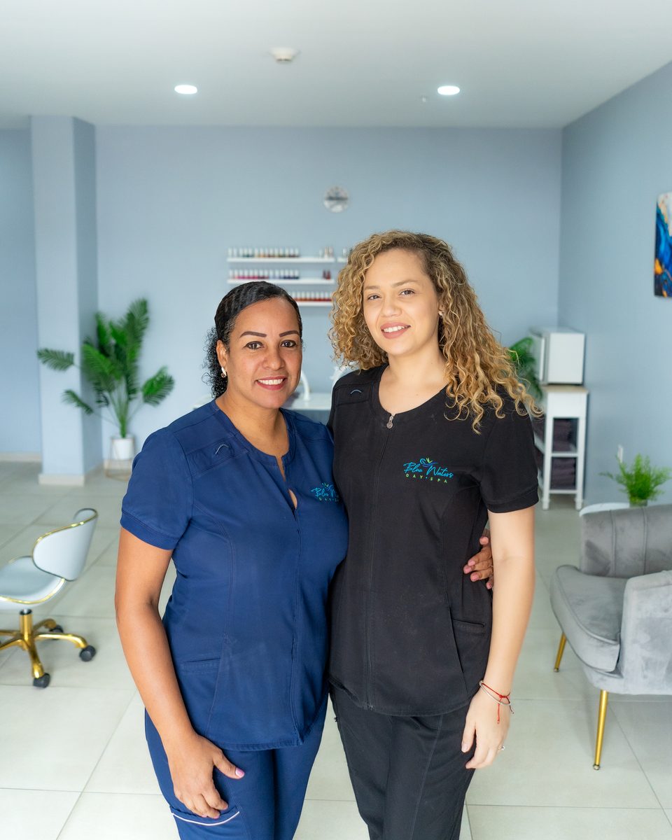 Two Blue Waters therapists standing together in the treatment room.